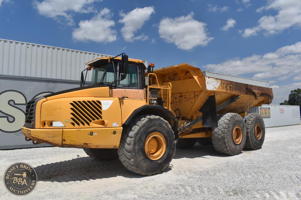 Heavy-duty yellow dump truck for construction and hauling at Bussey Bros Auctioneers.