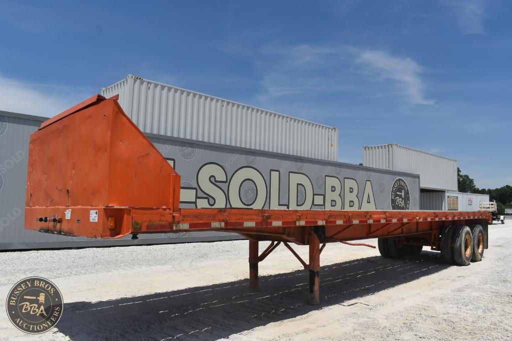 Heavy-duty flatbed trailer for sale at Bussey Bros Auctioneers, perfect for transporting heavy machi.