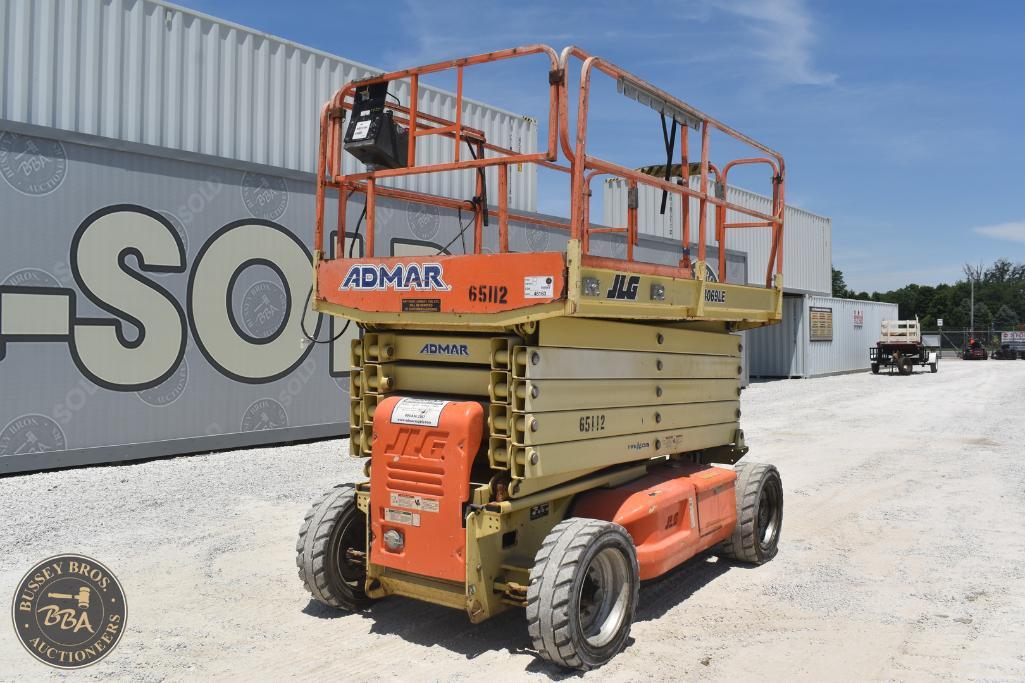 Scissor lift for sale at Bussey Bros Auctioneers, featuring ADMAR and JLG brands, ideal for construc.
