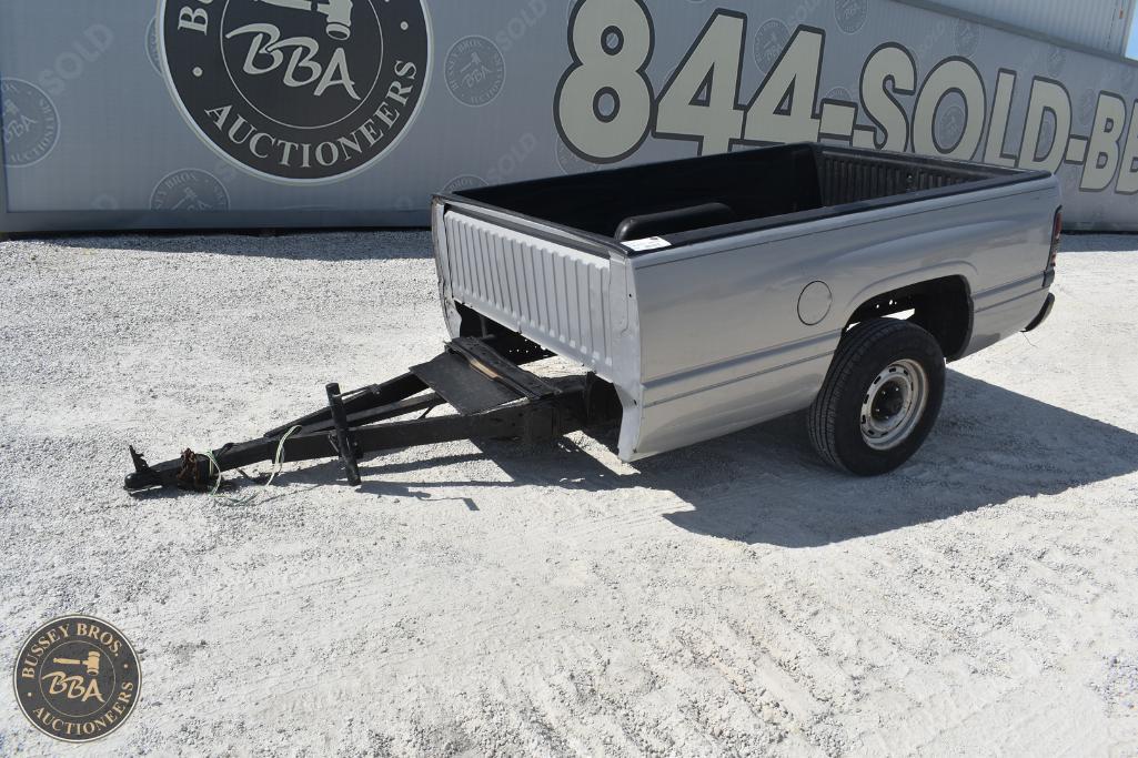Truck bed with towing hitch for sale at Bussey Bros Auctioneers.
