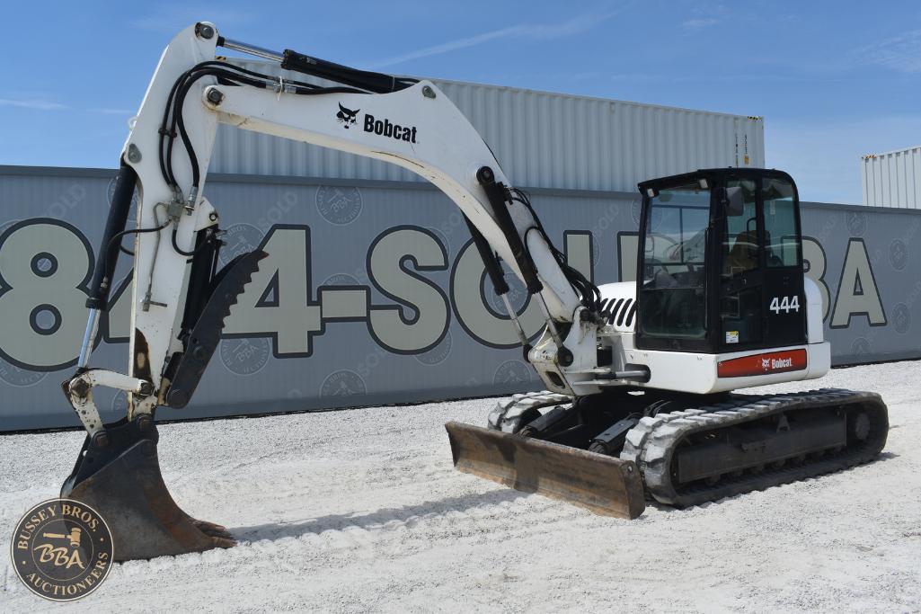 Excavator machine at Bussey Bros Auctioneers yard, ready for sale or auction.