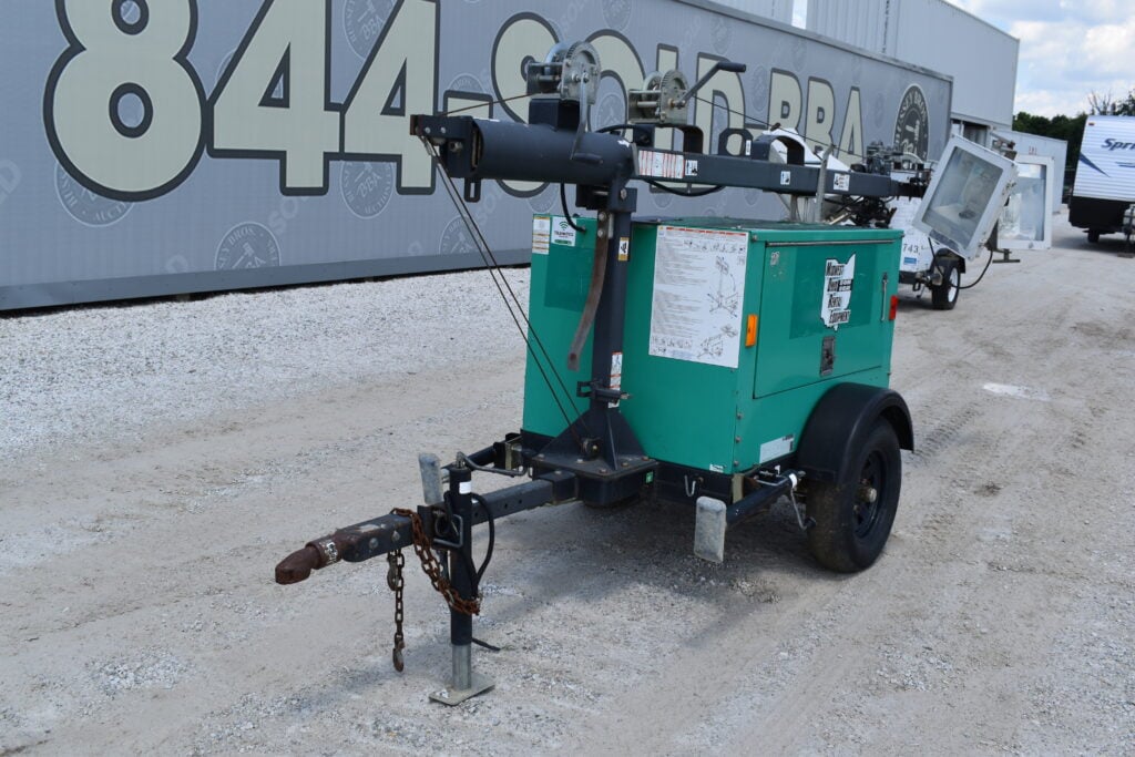 Portable light tower with generator for heavy equipment auction.