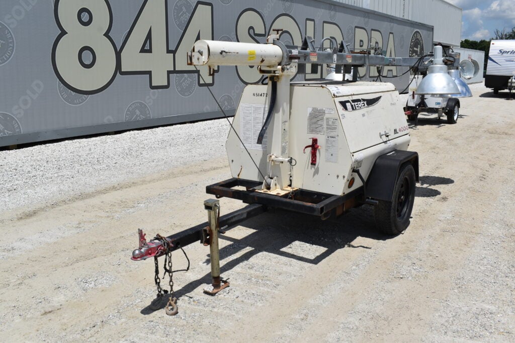 Portable light tower trailer for heavy equipment auction.