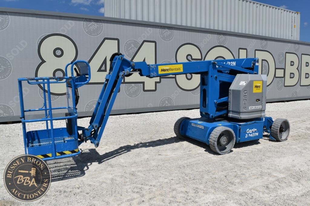 Blue Genie aerial work platform at heavy equipment auction site.