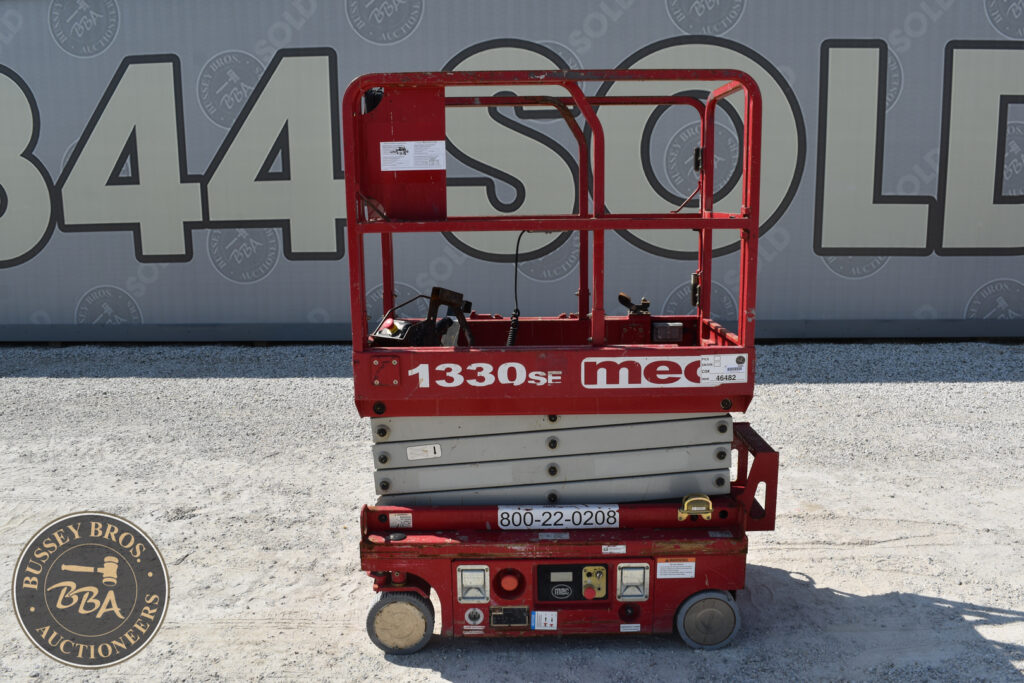 Red MEC 1330SF scissor lift at Bussey Bros Auction.