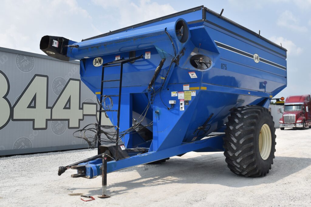Blue agricultural grain cart at Bussey Bros Auctioneers.