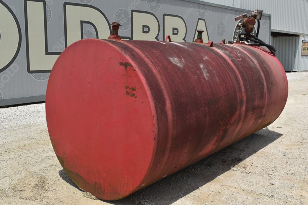Large red industrial tank at Bussey Bros Auctioneers.