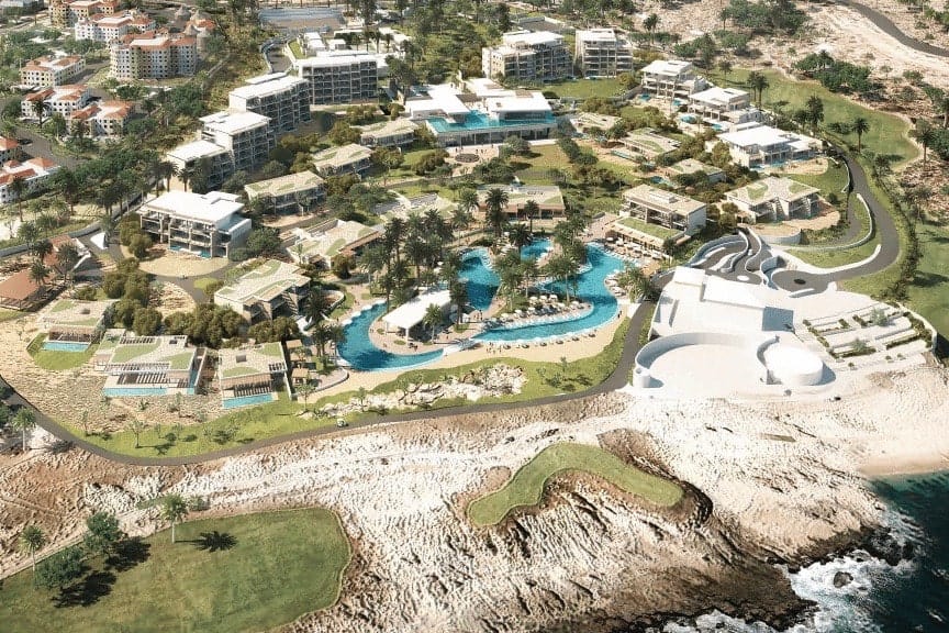 Modern Oceanview Villa To Buy Cabo Del Sol Featuring An Infinity Pool, Palm Trees, And Luxury Sun Loungers In Cabo San Lucas.