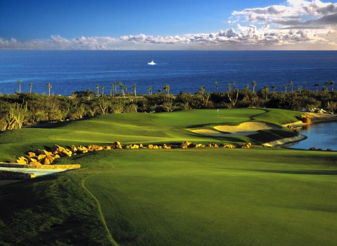 Scenic Cabo Del Sol Golf Course With Ocean Backdrop, Lush Fairways, And Dramatic Desert Landscaping Overlooking The Sea Of Cortez