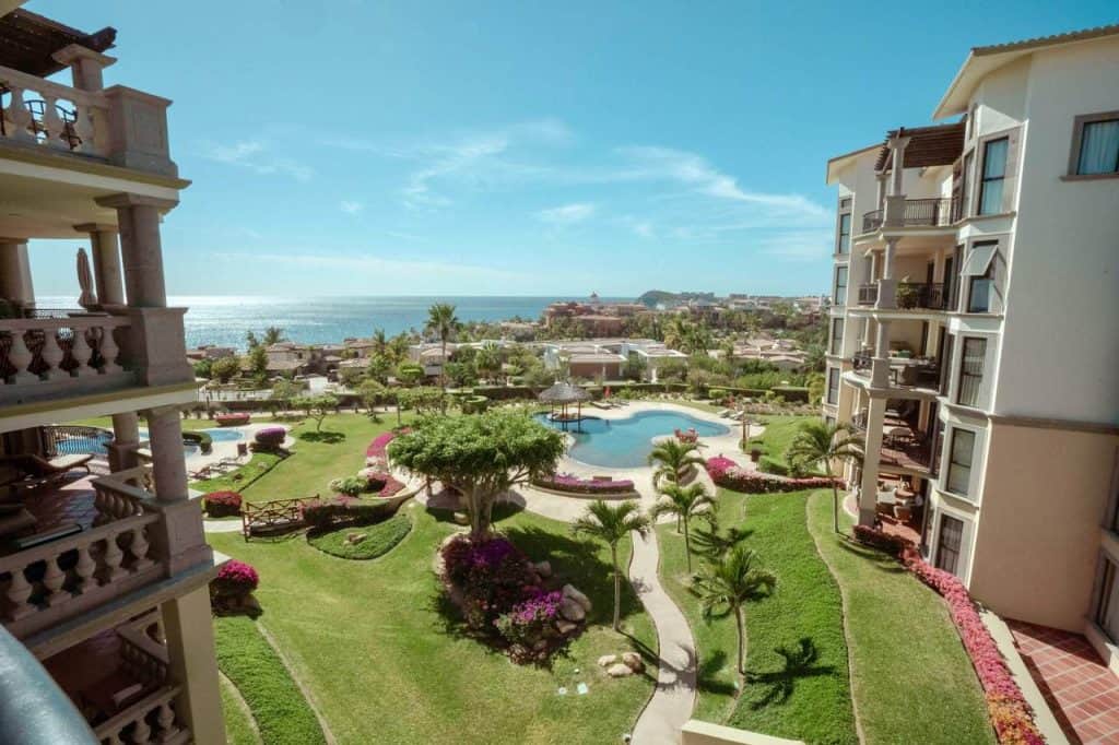 Luxury Beachfront Apartment With Ocean Views And Tropical Landscaping At Cabo Del Sol, Resort-Style Amenities, And Spacious Balconies For Relaxing And Enjoying The Seaside Scenery.
