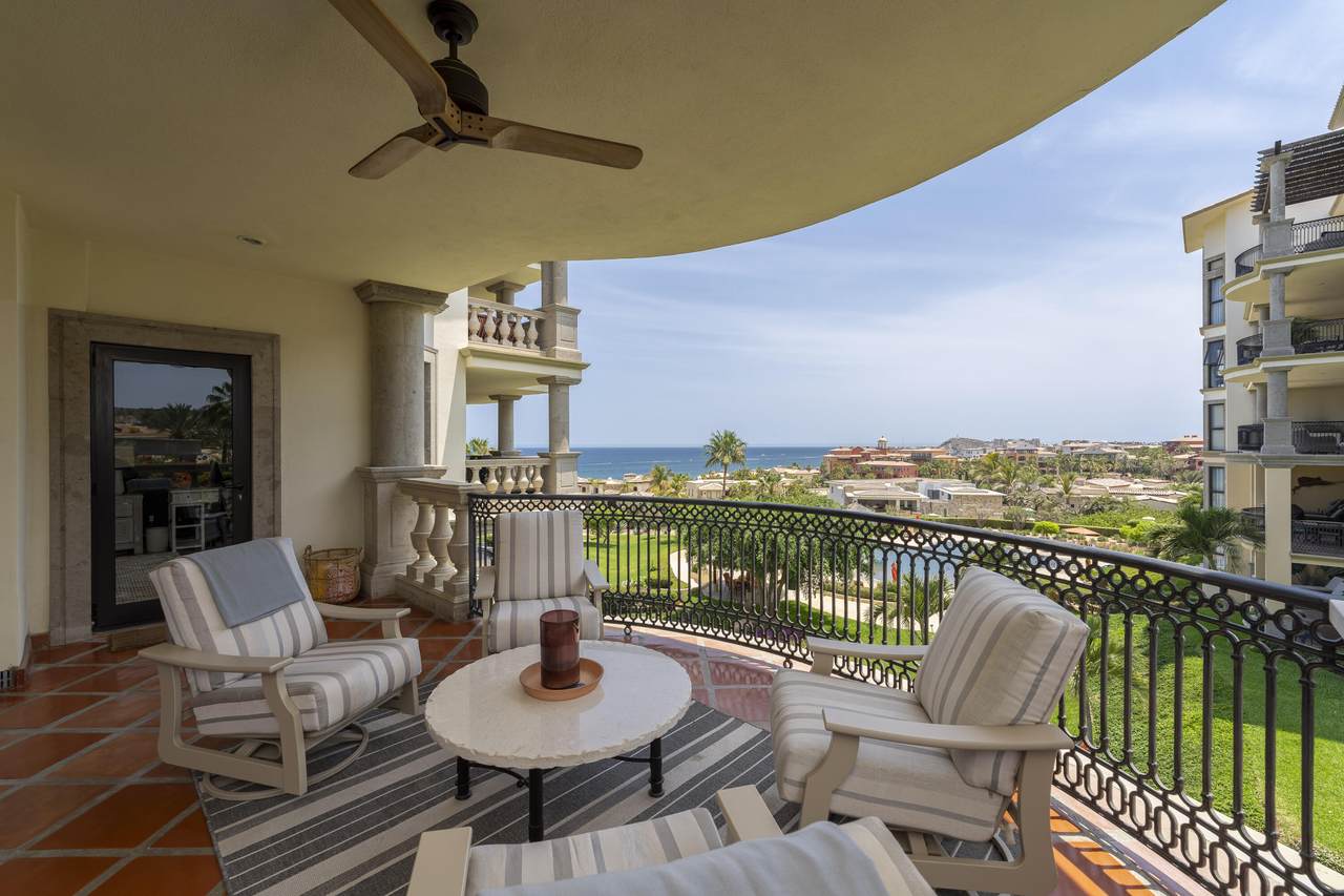 Luxurious Balcony Overlooking The Ocean With Elegant Seating And Scenic Views At Cabo Del Sol Real Estate. Perfect For Relaxing And Enjoying Coastal Tranquility.