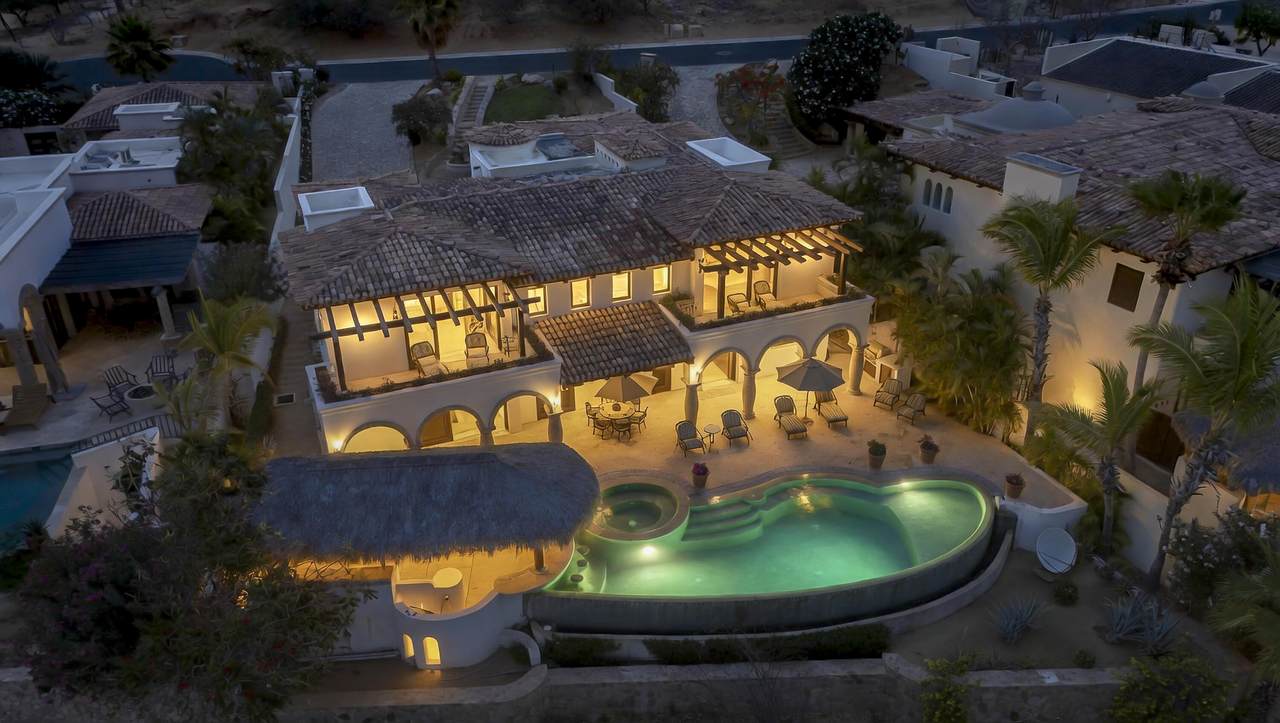 Luxury Cabo Del Sol Villa With Illuminated Pool And Spacious Outdoor Living Area At Sunset.