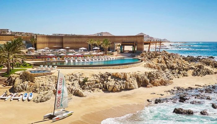 The Cove Club | Cabo Del Sol Real Estate Open-Air Dining And Lounge Area At The Cove Club In Cabo Del Sol With Infinity Pool, Golf Course Views, And The Sea Of Cortez In The Background