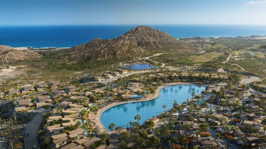 Aerial view of Cabo Real Surf Club wave basin and luxury residences with ocean views in Los Cabos