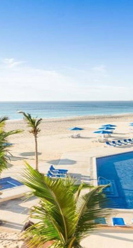 Sunset View Of Posada Real Los Cabos Pool Near Cabo Real Beaches &Amp; Pools With Palm Trees And Sea Of Cortez Horizon.