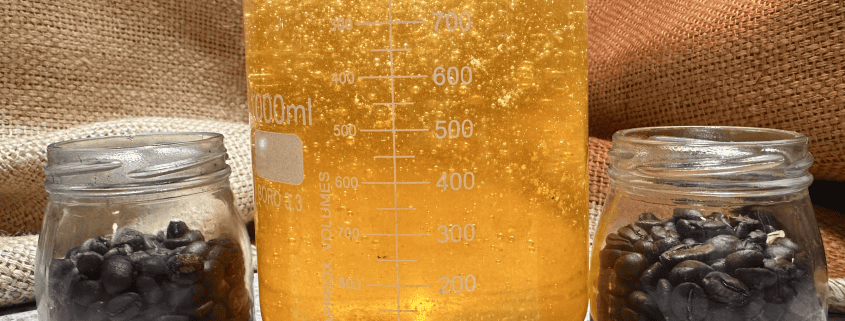 Rich coffee beans in jars with an espresso extraction process, perfect for Café Tolento's specialty coffee.