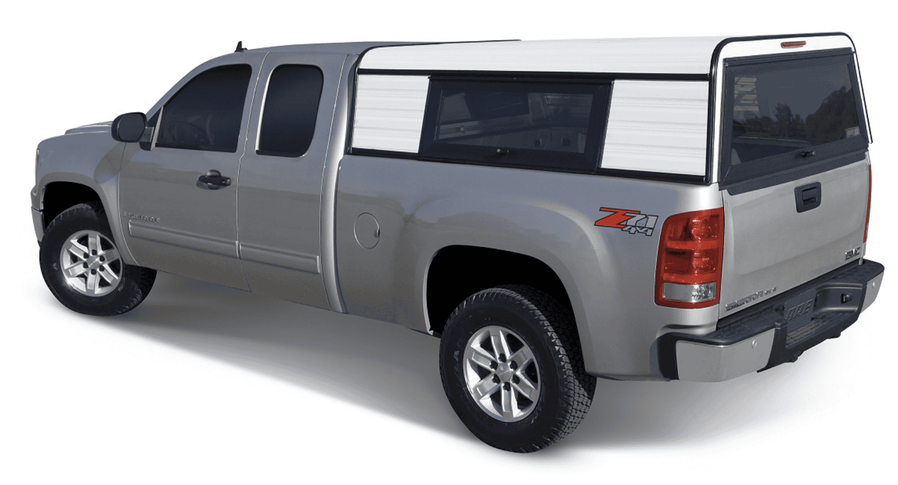 High-quality truck with camper shell available at Camp & Cruise for outdoor adventures.