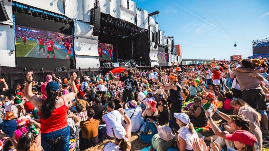 Crowd enjoying live music and football-themed entertainment at Rock in Rio Lisboa.