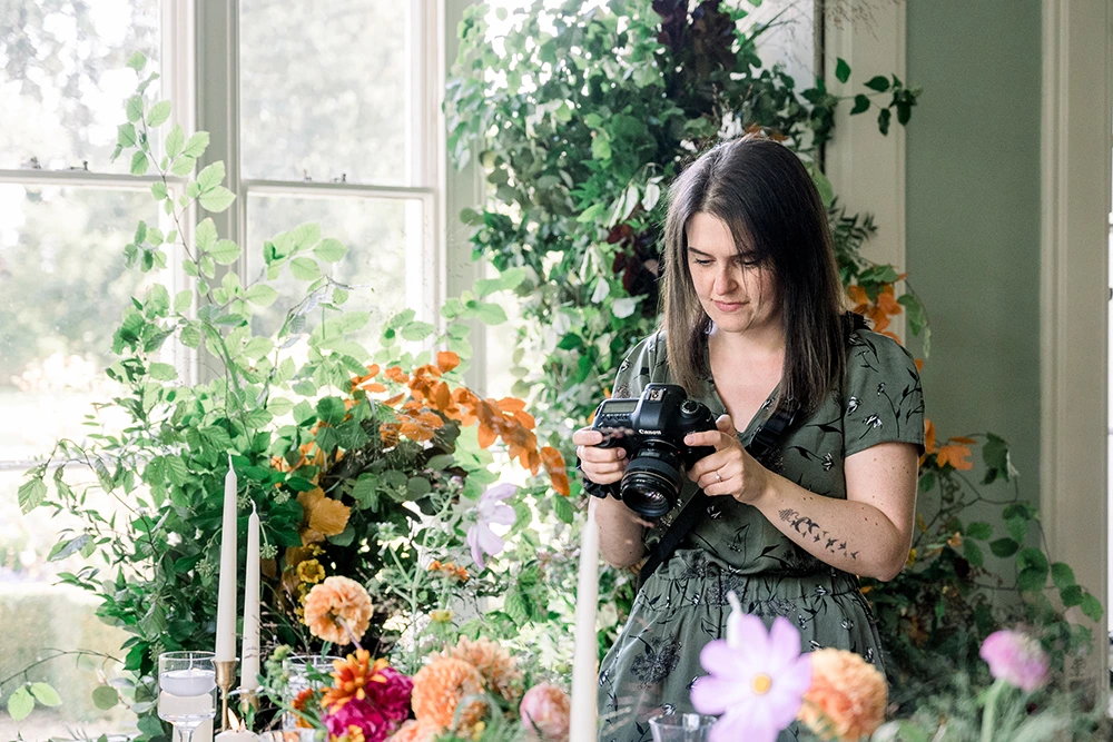 A photo of Rebecca Lloyd using her camera
