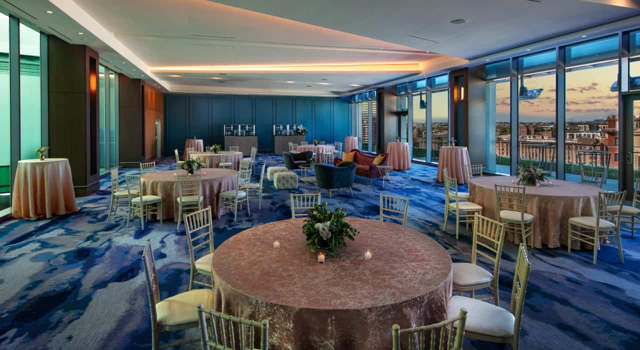 The Crown Ballroom at The Royal Sonesta Capitol Hill set up with round tables for a wedding.