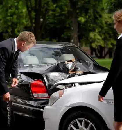 Professionals-Inspecting-Scene-Of-Car-Accident.