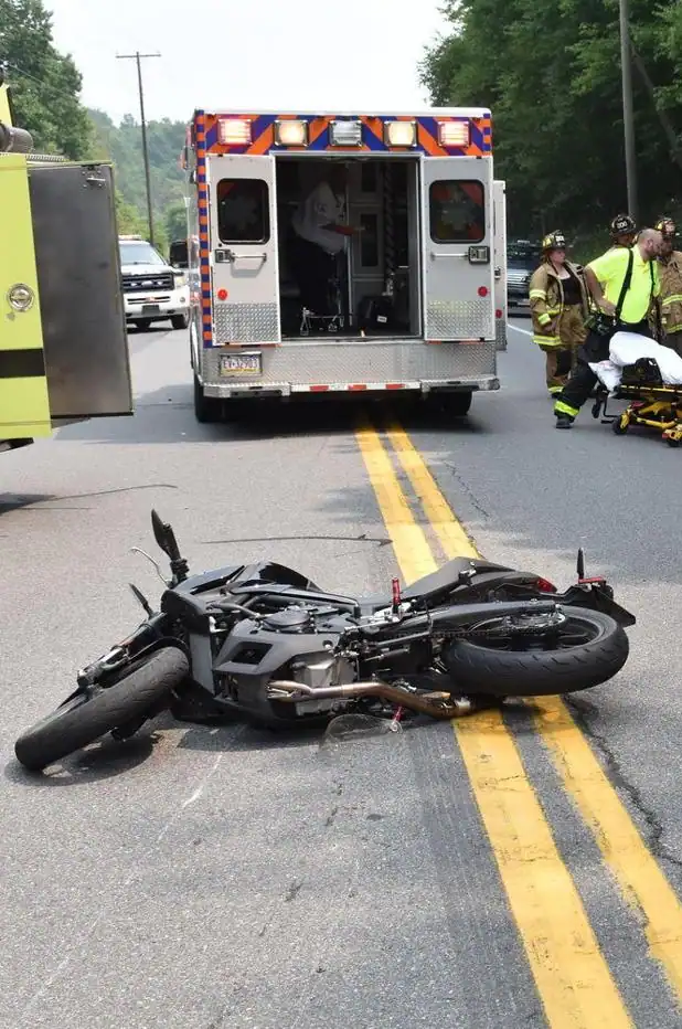 Wrecked-Motorcycle-Lying-Across-Yellow-Lines