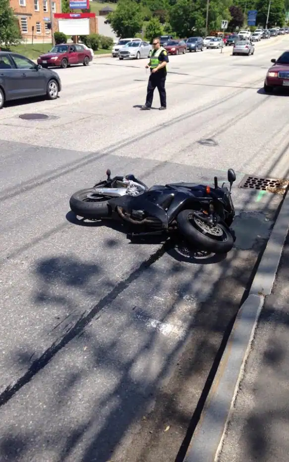 Black-Motorcycle-Down-On-City-Street