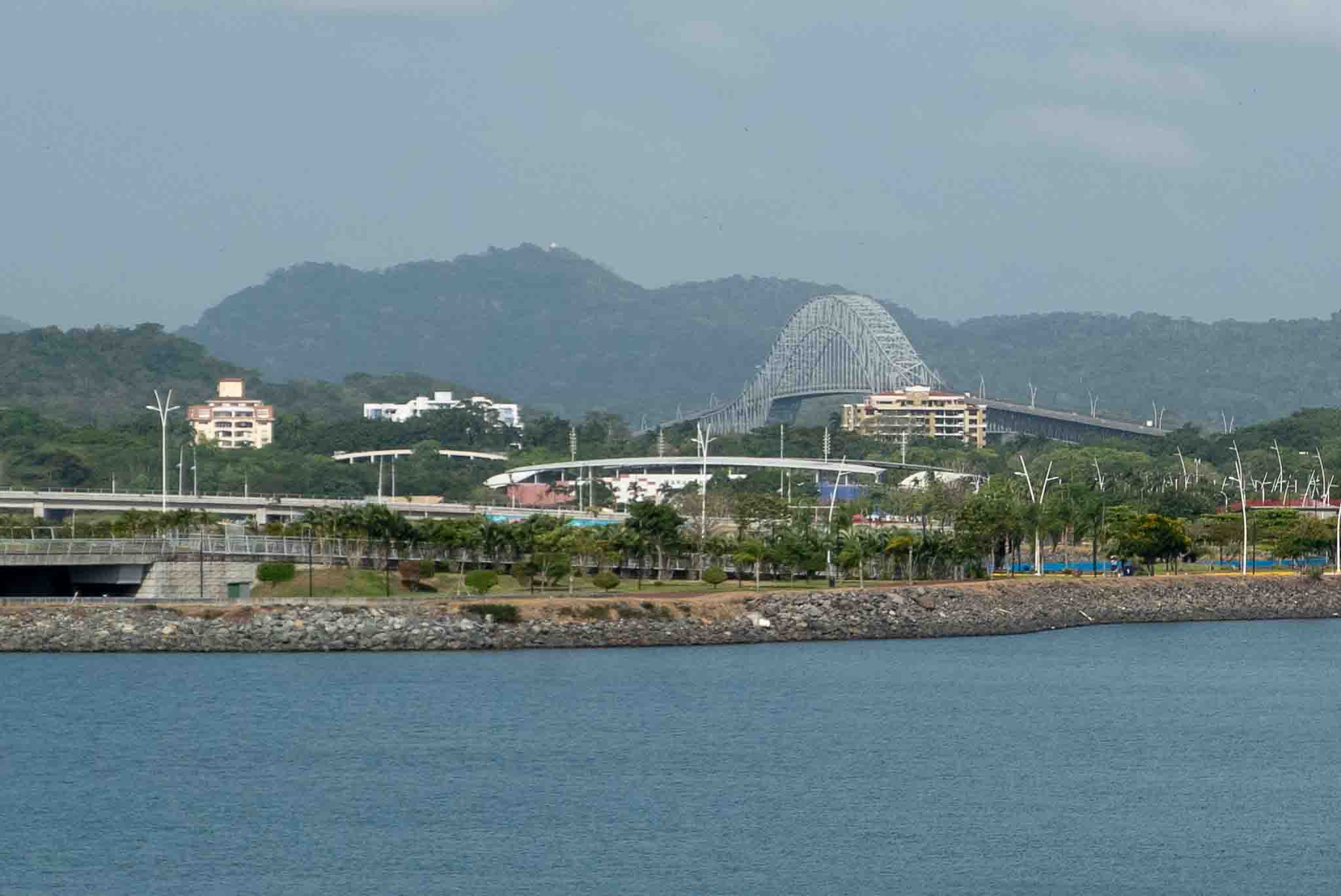 View of the Bridge of the Americas from Casco Viejo across the bay with hills in the background