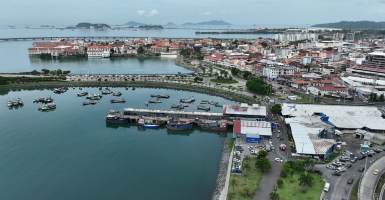 Aerial view of Casco Viejo Panama with plazas, rooftops, and the Pacific Ocean in the background