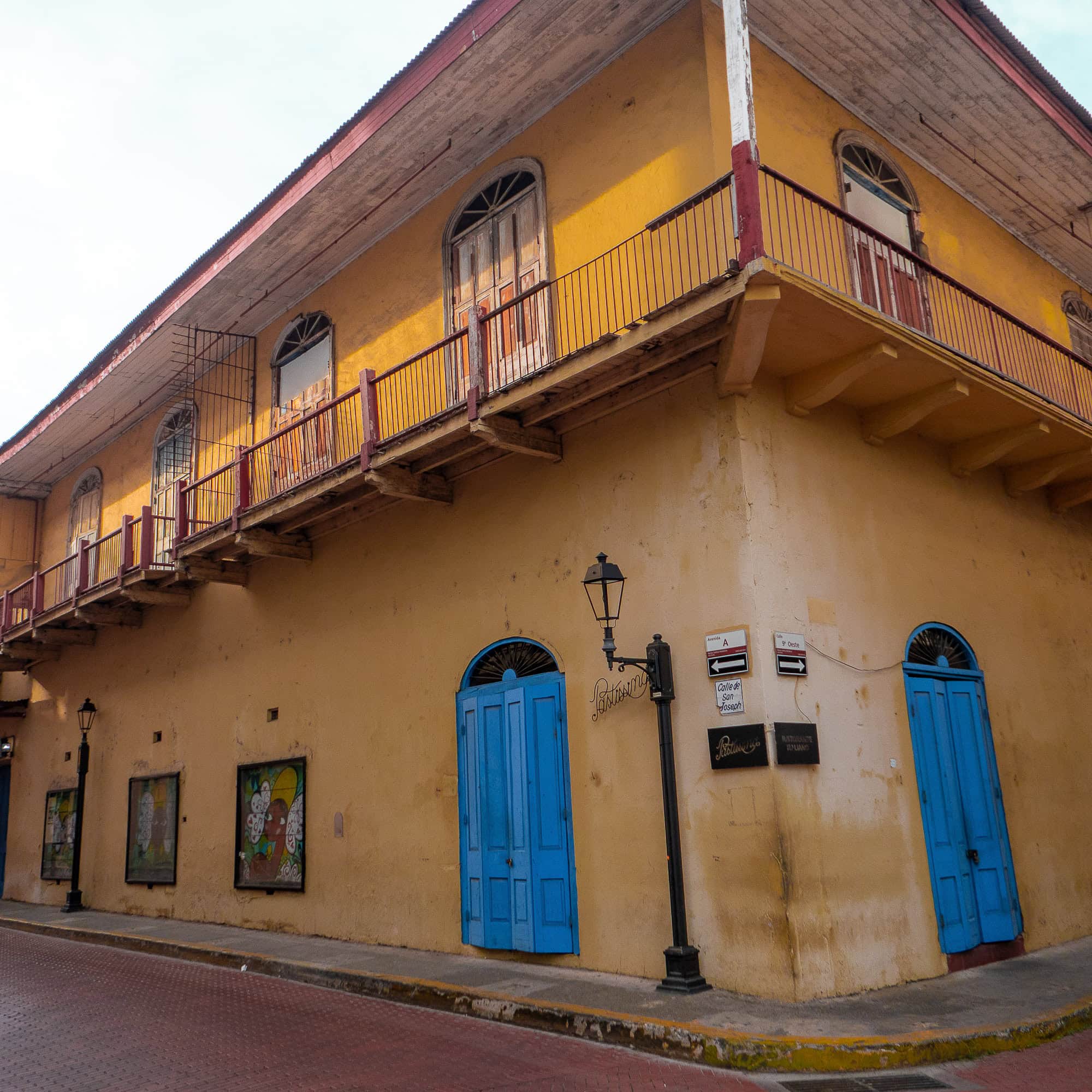 Colorful colonial building with bright blue doors in Casco Viejo, Panama