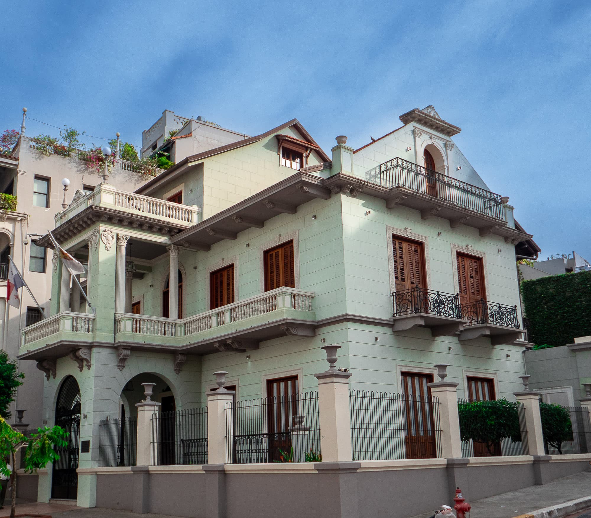 Restored mint green colonial mansion with wooden shutters in Casco Viejo, Panama