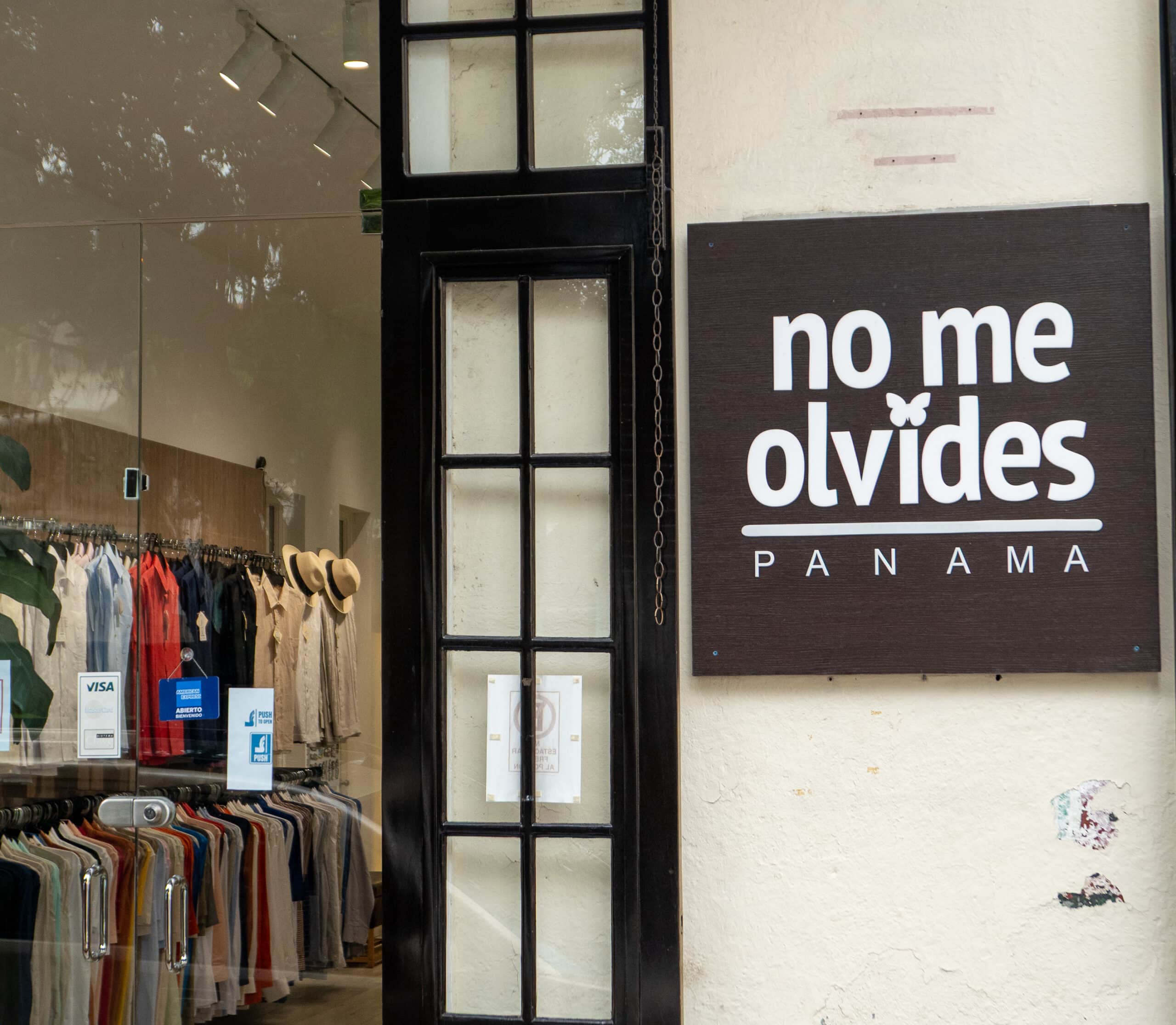 No Me Olvides boutique storefront in Casco Viejo, Panama with glass display and hanging clothes