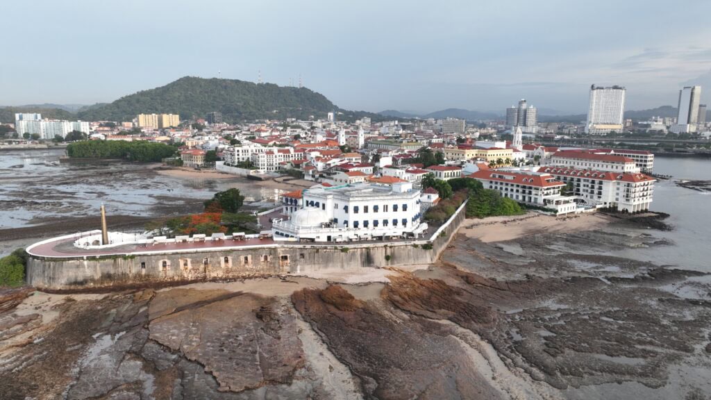Aerial view of Casco Viejo at low tide showing historic seawall and exposed Pacific Ocean seabed