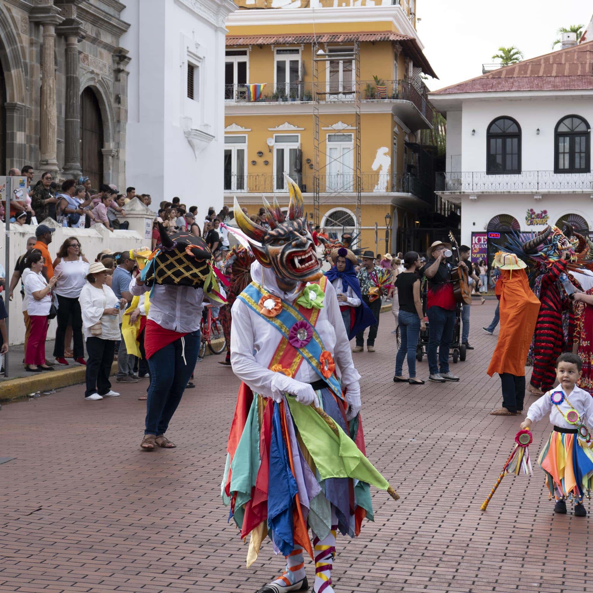 Diablico Sucio dancer and child in traditional costume during a parade in Casco Viejo Panama