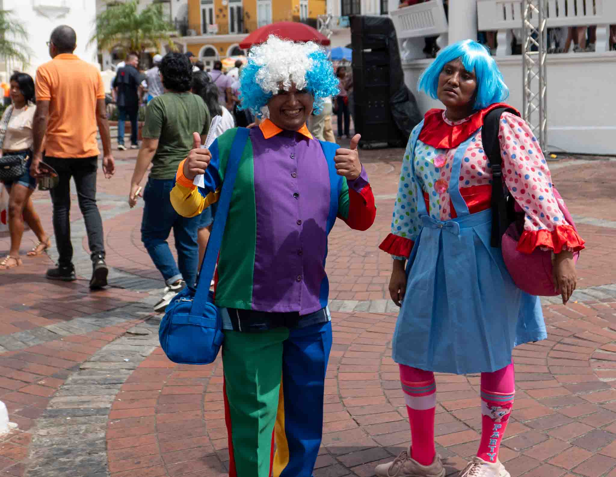 Two street performers dressed as colorful clowns at Plaza Catedral in Casco Viejo, Pana
