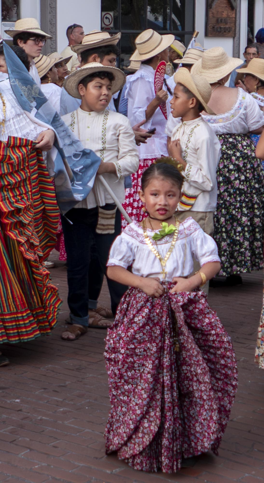 Young Panamanian girl in traditional dress during a street parade in Casco Viejo