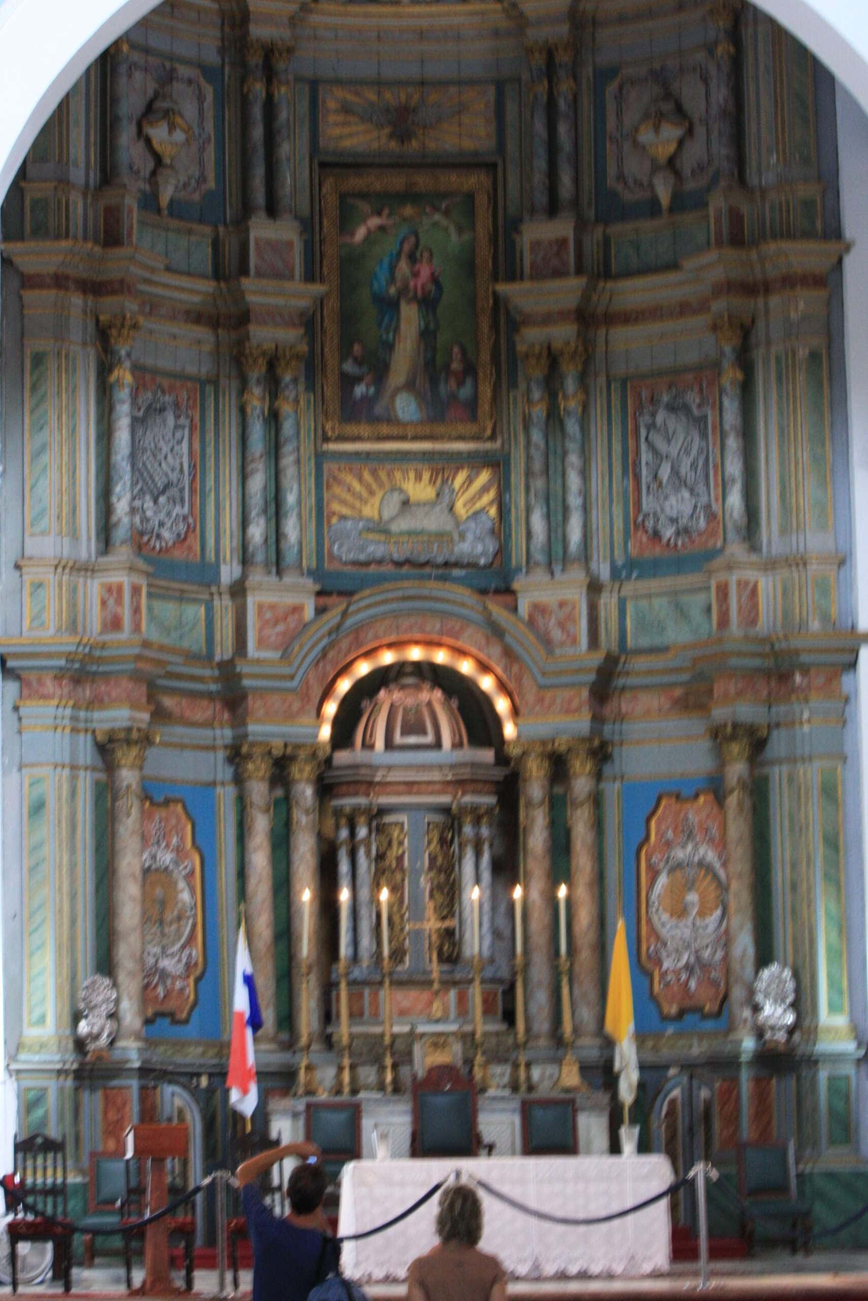 Cathedral altar in Casco Viejo, Panama, photographed before the 2018 restoration, showcasing original paint and aging details.