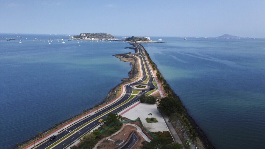 Aerial view of the Amador Causeway stretching into the Pacific Ocean, linking Panama City to the islands.