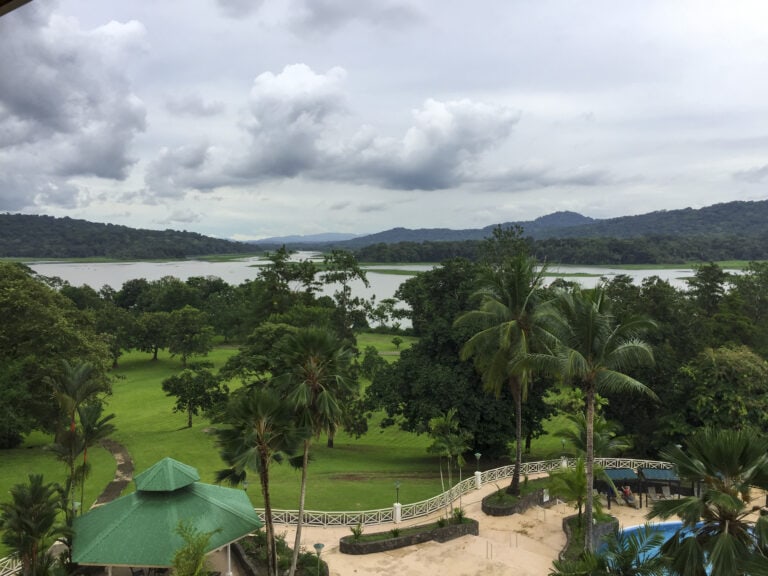 Lush rainforest and distant canal waters viewed from a hilltop resort in Gamboa, Panama on a cloudy day.