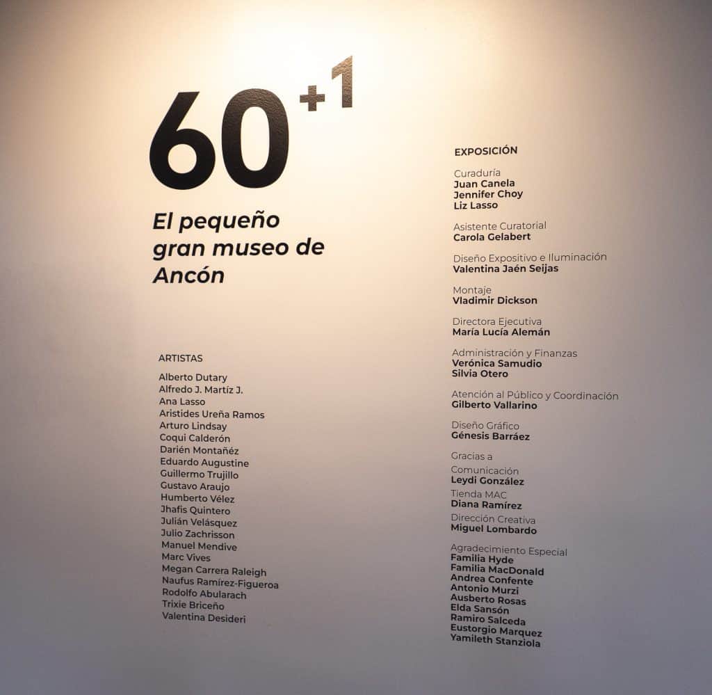Wall text of the 60+1 exhibition at MAC Panamá Casco Antiguo listing participating artists and curators