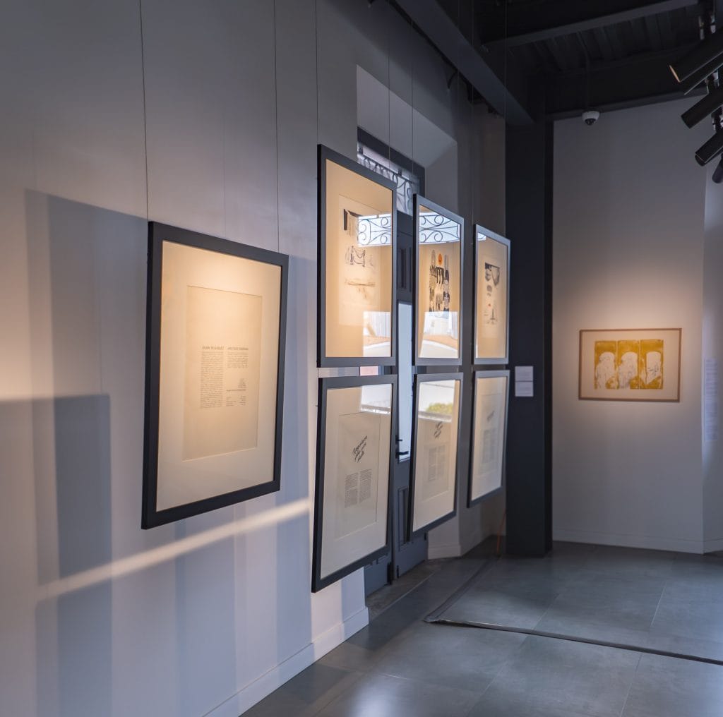 Framed artworks from the permanent collection displayed at MAC Panamá Casco Antiguo exhibition space