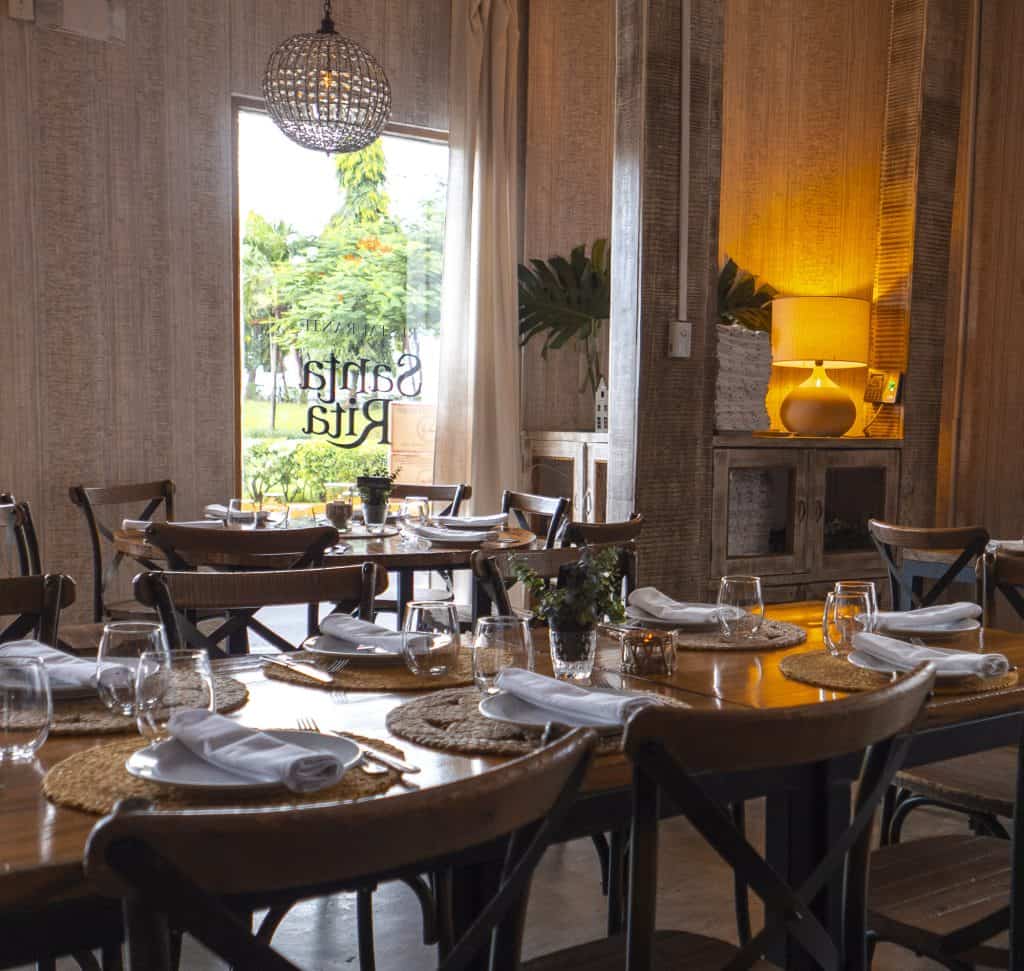 Santa Rita Casco Viejo dining room with rustic tables and window view