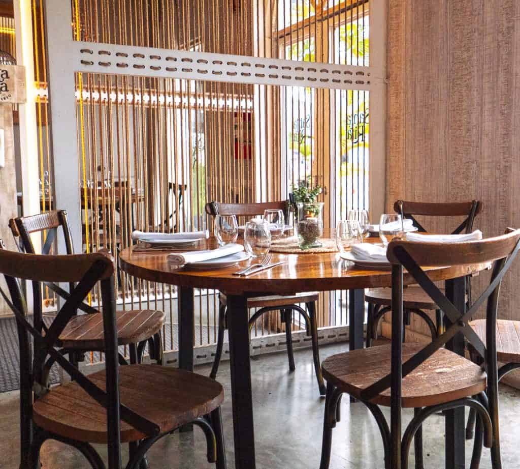 Santa Rita Casco Viejo round table dining setup with rustic wooden chairs