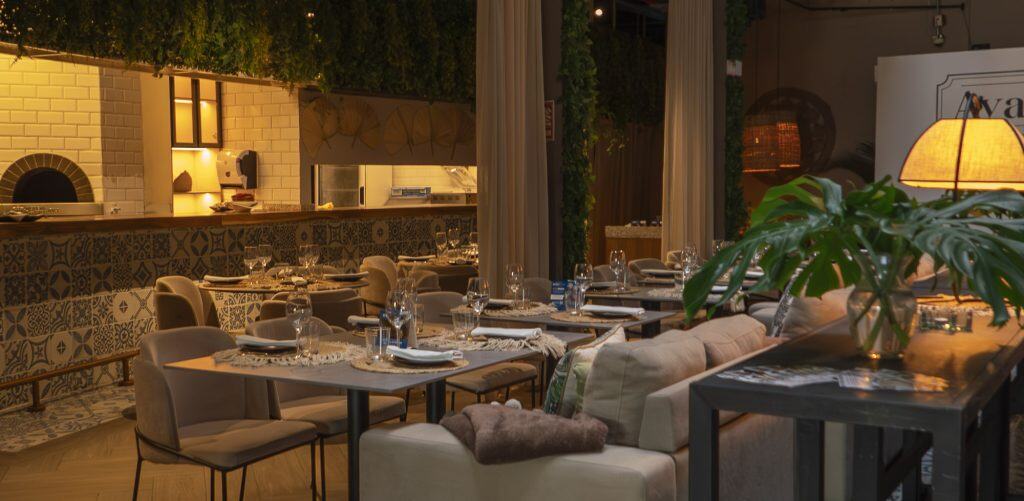 Aya La Vida Casco Viejo pizza kitchen with wood-fired oven and dining tables