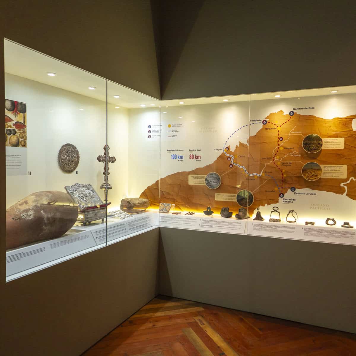 Archaeological display with ancient artifacts and a topographic map of Panama at the Panama Canal Museum in Casco Viejo, showing early trade routes and cultural influences before the canal’s construction. Now part of the Panama Canal Museum Renovation