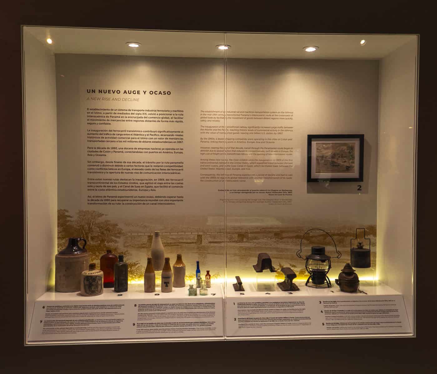 Display case titled “Un Nuevo Auge y Ocaso” showing historical artifacts from the French and early American Canal eras at the renovated Panama Canal Museum in Casco Viejo.