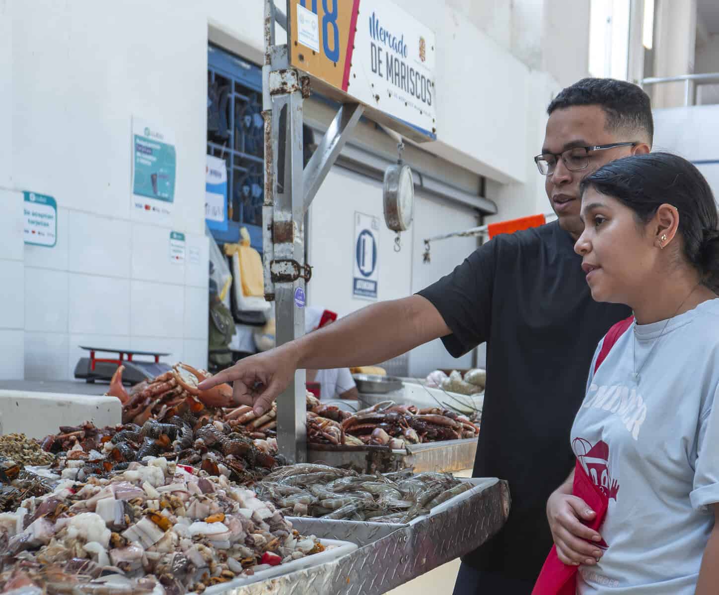 Chefs Ericka Rodriguez and Carlos H. Smith Q. selecting seafood at the Panama City Fish Market near Casco Viejo.