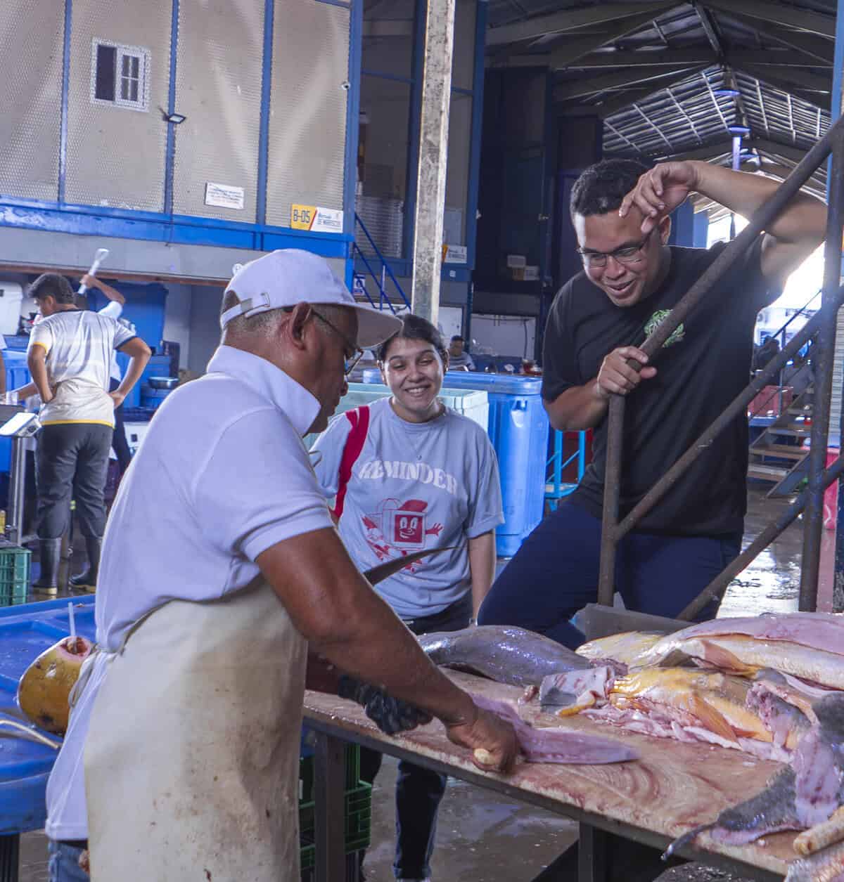 Chefs Ericka Rodriguez and Carlos H. Smith Q. walking through the Panama City Fish Market near Casco Viejo to buy fresh seafood.