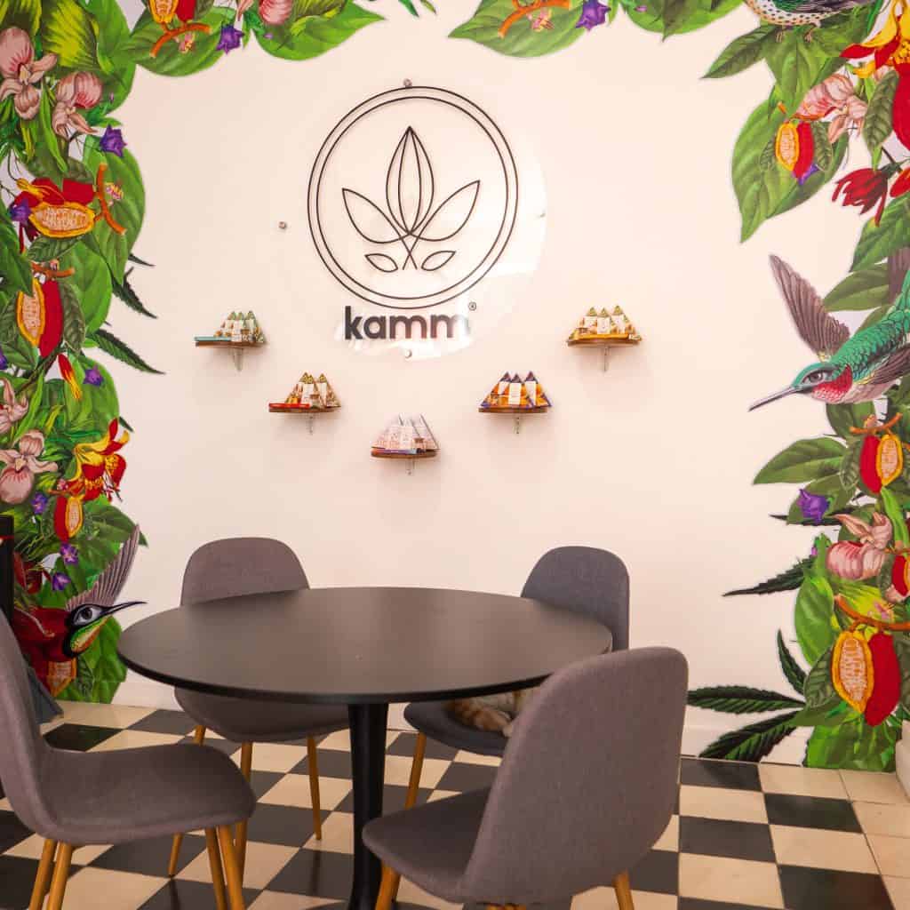 Galería Solar chocolate tasting table with colorful mural and Kamm logo in Casco Viejo, Panama