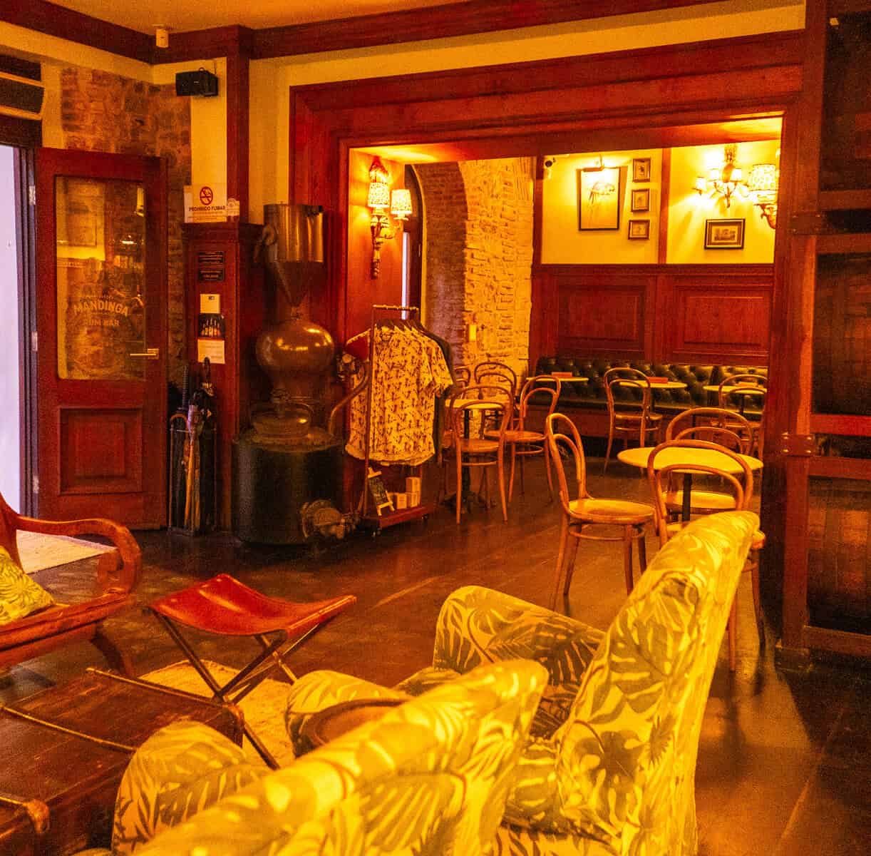 Warm lounge and social seating area inside Mandinga Rum Bar in Casco Viejo, Panama